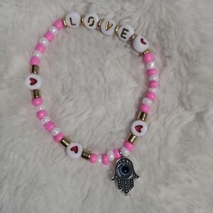 Pink and White Beaded Bracelet with Hamsa Charm